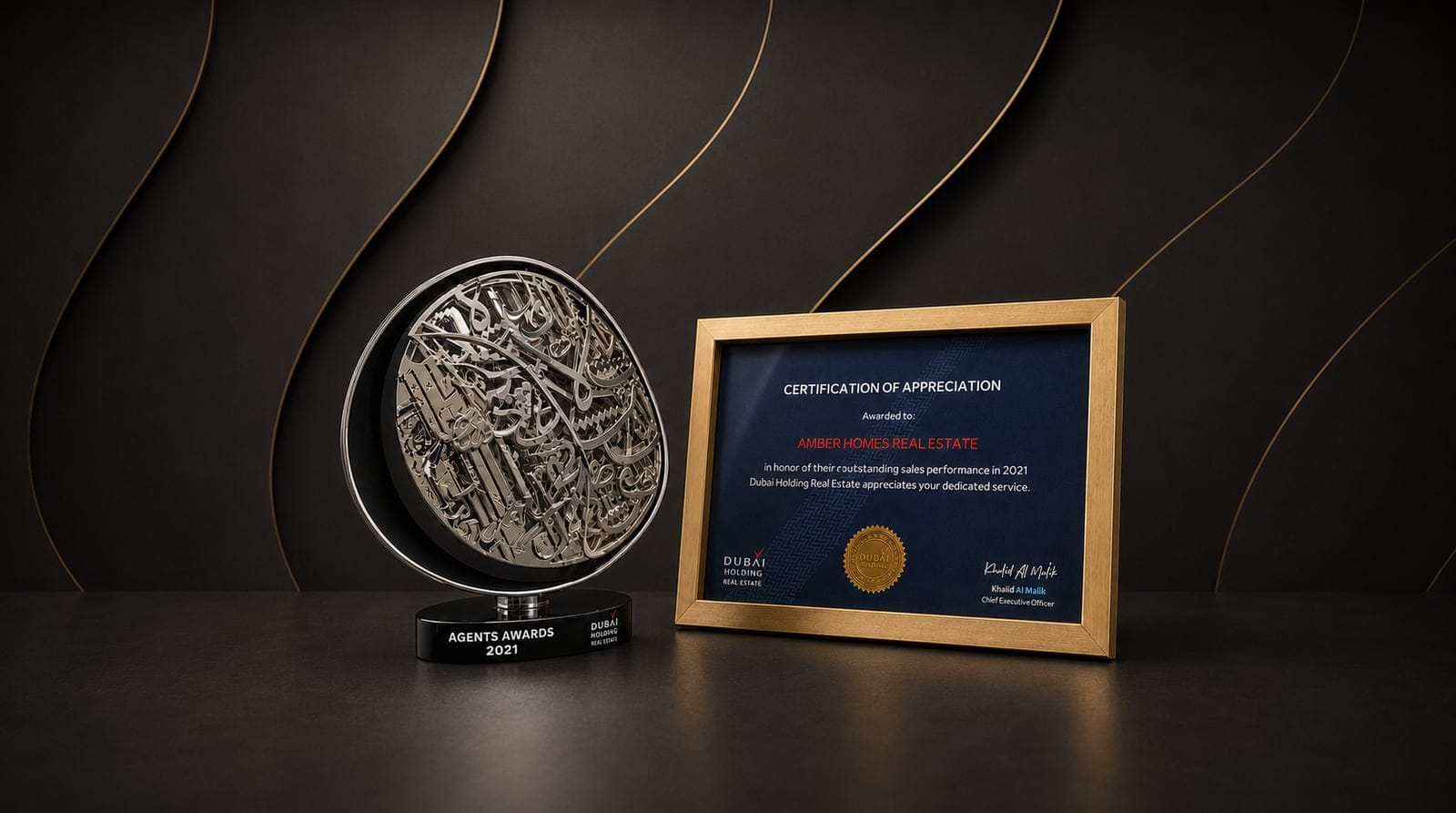 Amber Homes Real Estate — Top Platinum Sales Agency 2022, awarded by Meraas, Nakheel & Dubai Holding (award trophy and certificate)