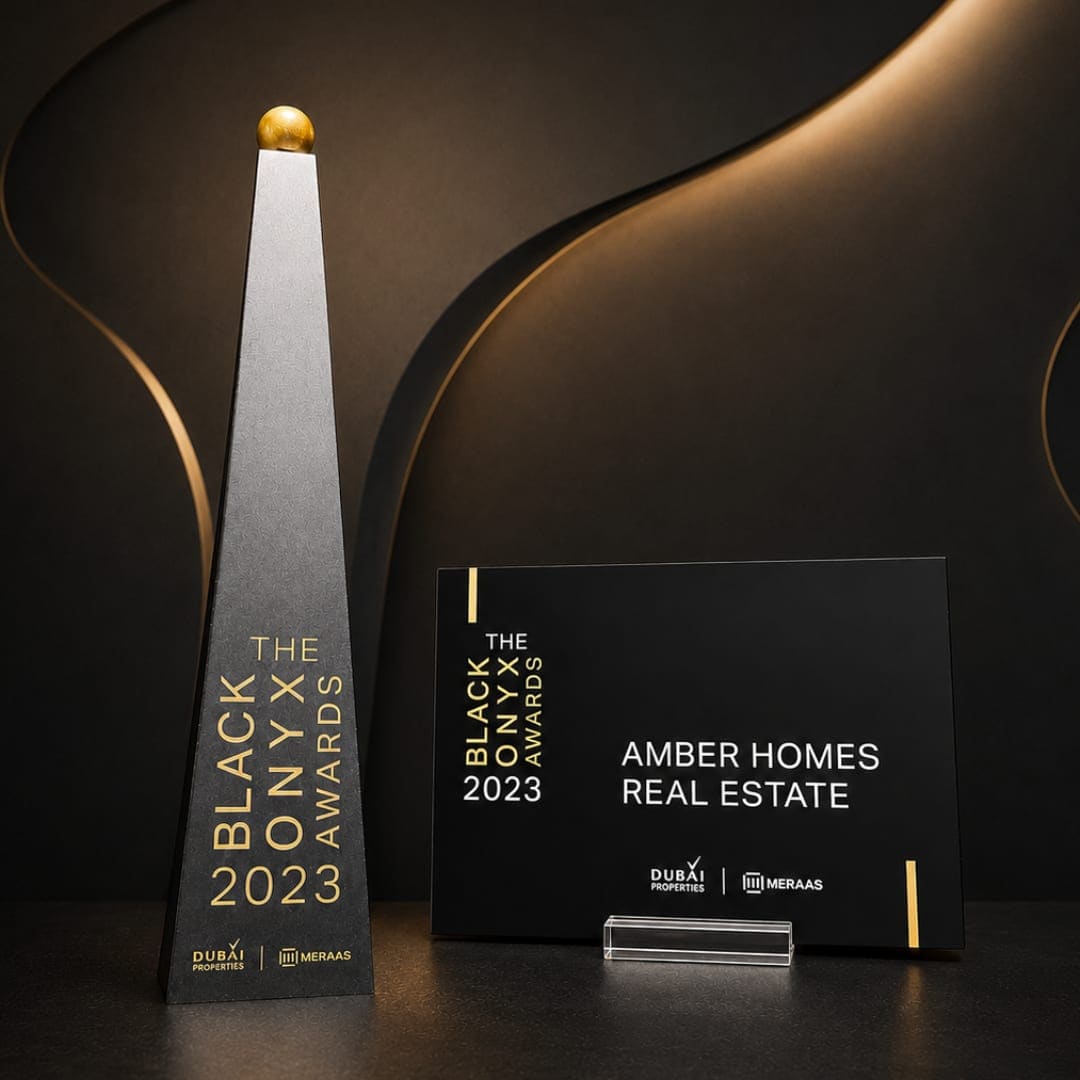 Amber Homes Real Estate — Platinum Sales Agency 2023, awarded by Meraas, Nakheel & Dubai Holding (award trophy and certificate)