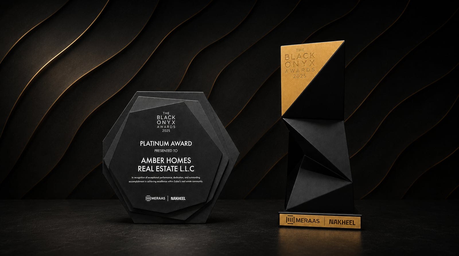 Amber Homes Real Estate — Top Platinum Sales Agency 2025, awarded by Meraas, Nakheel & Dubai Holding (award trophy and certificate)