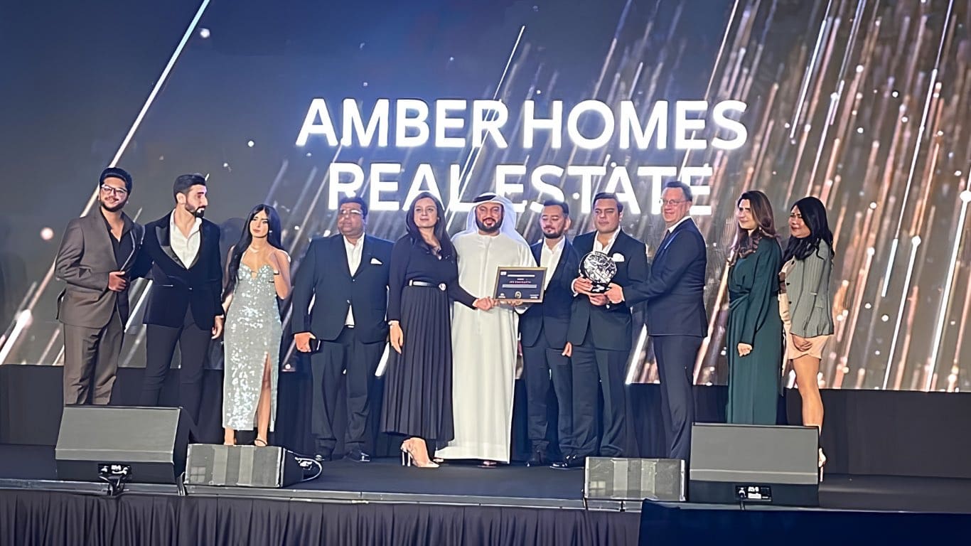 Ambreen Qureshi and the Amber Homes Real Estate team on stage — Platinum Agency 2022